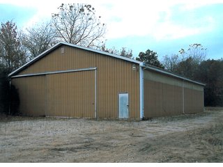 6.5 Acres including 13,176 sq. ft. commercial building in good condition.    Office area is 48' x 54', shop is 54' x 124'; and storage area is 54' x 72'.  

Office area is 2,592 sq. ft. with central air.  Natural gas heating.  Shop has floor drains and (2) overhead doors, used oil furnace, and large overhead hoist. - Commercial Building on 6.5 Acres