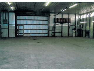 6.5 Acres including 13,176 sq. ft. commercial building in good condition.    Office area is 48' x 54', shop is 54' x 124'; and storage area is 54' x 72'.  

Office area is 2,592 sq. ft. with central air.  Natural gas heating.  Shop has floor drains and (2) overhead doors, used oil furnace, and large overhead hoist. - Commercial Building on 6.5 Acres