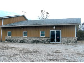6.5 Acres including 13,176 sq. ft. commercial building in good condition.    Office area is 48' x 54', shop is 54' x 124'; and storage area is 54' x 72'.  

Office area is 2,592 sq. ft. with central air.  Natural gas heating.  Shop has floor drains and (2) overhead doors, used oil furnace, and large overhead hoist. - Commercial Building on 6.5 Acres