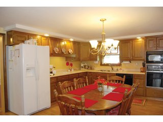 A very private setting with a unique view down the length of Shriner Lake.  Beautiful country setting with mature trees, great views of the lake from an elevated deck.  Road frontage on two sides!  Includes lovely orchard.  Great location close to Columbia City and Fort Wayne, - Lakefront Property on Shriner Lake