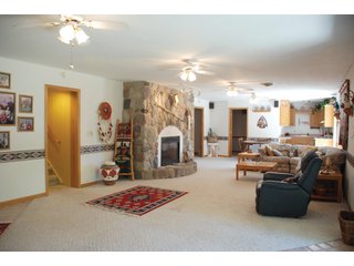 A very private setting with a unique view down the length of Shriner Lake.  Beautiful country setting with mature trees, great views of the lake from an elevated deck.  Road frontage on two sides!  Includes lovely orchard.  Great location close to Columbia City and Fort Wayne, - Lakefront Property on Shriner Lake