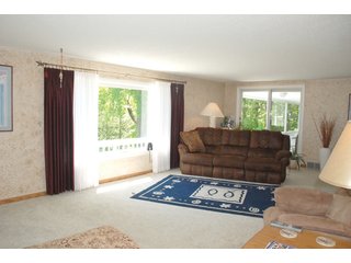 A very private setting with a unique view down the length of Shriner Lake.  Beautiful country setting with mature trees, great views of the lake from an elevated deck.  Road frontage on two sides!  Includes lovely orchard.  Great location close to Columbia City and Fort Wayne, - Lakefront Property on Shriner Lake