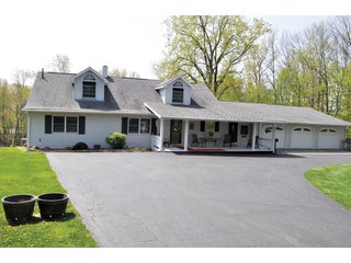 A very private setting with a unique view down the length of Shriner Lake.  Beautiful country setting with mature trees, great views of the lake from an elevated deck.  Road frontage on two sides!  Includes lovely orchard.  Great location close to Columbia City and Fort Wayne, - Lakefront Property on Shriner Lake