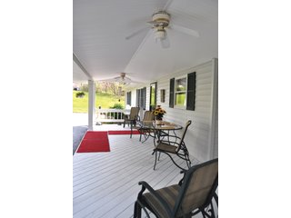 A very private setting with a unique view down the length of Shriner Lake.  Beautiful country setting with mature trees, great views of the lake from an elevated deck.  Road frontage on two sides!  Includes lovely orchard.  Great location close to Columbia City and Fort Wayne, - Lakefront Property on Shriner Lake