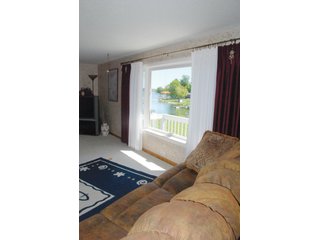 A very private setting with a unique view down the length of Shriner Lake.  Beautiful country setting with mature trees, great views of the lake from an elevated deck.  Road frontage on two sides!  Includes lovely orchard.  Great location close to Columbia City and Fort Wayne, - Lakefront Property on Shriner Lake