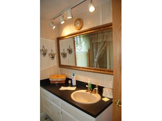 A very private setting with a unique view down the length of Shriner Lake.  Beautiful country setting with mature trees, great views of the lake from an elevated deck.  Road frontage on two sides!  Includes lovely orchard.  Great location close to Columbia City and Fort Wayne, - Lakefront Property on Shriner Lake