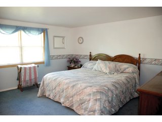 A very private setting with a unique view down the length of Shriner Lake.  Beautiful country setting with mature trees, great views of the lake from an elevated deck.  Road frontage on two sides!  Includes lovely orchard.  Great location close to Columbia City and Fort Wayne, - Lakefront Property on Shriner Lake