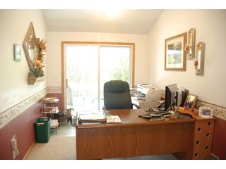 A very private setting with a unique view down the length of Shriner Lake.  Beautiful country setting with mature trees, great views of the lake from an elevated deck.  Road frontage on two sides!  Includes lovely orchard.  Great location close to Columbia City and Fort Wayne, - Lakefront Property on Shriner Lake