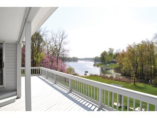 A very private setting with a unique view down the length of Shriner Lake.  Beautiful country setting with mature trees, great views of the lake from an elevated deck.  Road frontage on two sides!  Includes lovely orchard.  Great location close to Columbia City and Fort Wayne, - Lakefront Property on Shriner Lake