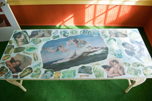 Wicker Table with angel, cupids and rising venus collage. Glass top. - Extraordinary Auction - Nike Spillson Home Interiors & Furnishings