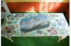 Wicker Table with angel, cupids and rising venus collage. Glass top. - Extraordinary Auction - Nike Spillson Home Interiors & Furnishings