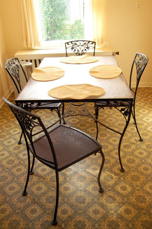 Woodard cast iron patio table 42 in. x 72 in. with 8 chairs. Plexiglas top. Two additional side tables. - Extraordinary Auction - Nike Spillson Home Interiors & Furnishings