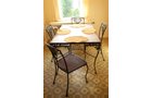 Woodard cast iron patio table 42 in. x 72 in. with 8 chairs. Plexiglas top. Two additional side tables. - Extraordinary Auction - Nike Spillson Home Interiors & Furnishings