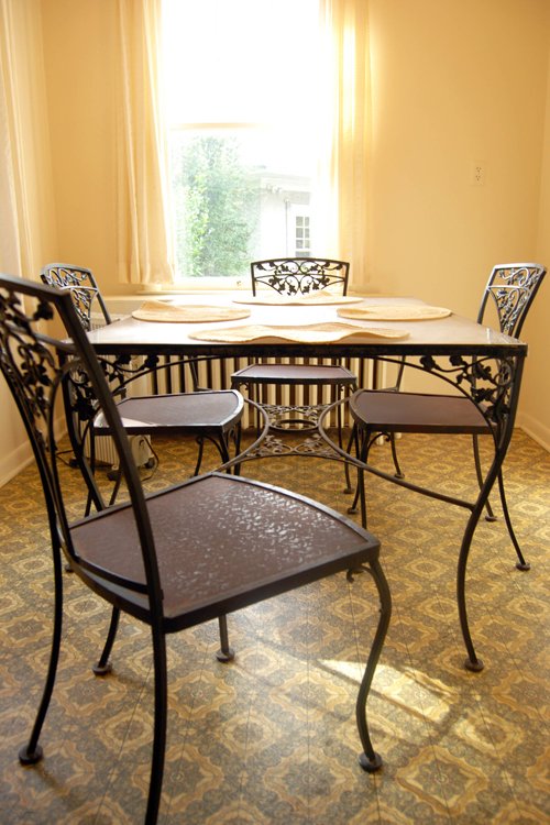Woodard cast iron patio table 42 in. x 72 in. with 8 chairs. Plexiglas top. Two additional side tables. - Extraordinary Auction - Nike Spillson Home Interiors & Furnishings