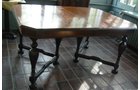 Walnut veneer dining room table. Ebonized legs. With 4 leaves. 45 in.W x 60 in. without leaves X 100 in. with all 4 leaves. Seats 6 to 12. - Extraordinary Auction - Nike Spillson Home Interiors & Furnishings