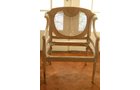 Cane back chair that matches cane back settee. Striped and unfinished. Comes with original padding.  27 in.W - Extraordinary Auction - Nike Spillson Home Interiors & Furnishings