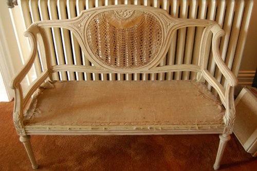 Cane back settee. Striped and unfinished. Comes with original padding. 4 ft.W x 18 in.D x 34 in.H - Extraordinary Auction - Nike Spillson Home Interiors & Furnishings