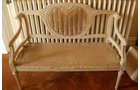 Cane back settee. Striped and unfinished. Comes with original padding. 4 ft.W x 18 in.D x 34 in.H - Extraordinary Auction - Nike Spillson Home Interiors & Furnishings