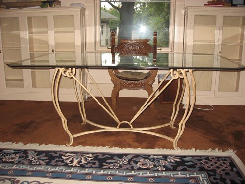 Glass Top table with decorative rod iron base. Condition. Small chip. 42 in. x  72 in. - Extraordinary Auction - Nike Spillson Home Interiors & Furnishings