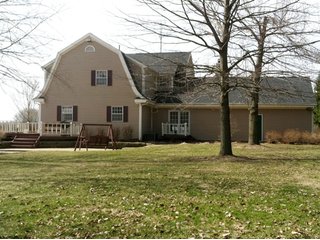 2961 Sq. Ft. 4 Bedroom, 2.5 bath home on 1.7 acres.  Forced air heat, central air, and attached 2-1/2 car garage.  

Built in 1930.  Total renovation in 1986.  Updated in 2006.  Beautiful country setting.  Adjacent to 14 acre private lake and park like setting with access. - Home with Beautiful Country Setting