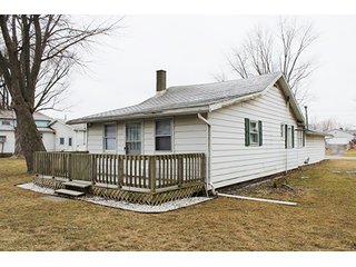 This home offers 980+/- square feet of living space with some furnishings and a 24 x 25 attached two car garage with work space.  Home features a full kitchen with newer range and refrigerator, two or three bedrooms and one full bath with stackable washer and dryer.  The home has ductwork throughout, however the furnace has been removed.  

Great channel front deck for lake view cookouts and new aluminum boat dock with approximately 75' of channel frontage. - Hoffman Lake Channel Front Home