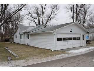 This home offers 980+/- square feet of living space with some furnishings and a 24 x 25 attached two car garage with work space.  Home features a full kitchen with newer range and refrigerator, two or three bedrooms and one full bath with stackable washer and dryer.  The home has ductwork throughout, however the furnace has been removed.  

Great channel front deck for lake view cookouts and new aluminum boat dock with approximately 75' of channel frontage. - Hoffman Lake Channel Front Home