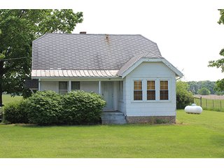 74 Acres with 2 homes and buildings.  Gently rolling land with 52+/- tillable acres and 18+/- wooded acres. - 74 Acres with 2 Homes & Buildings