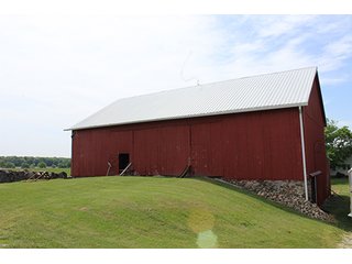 74 Acres with 2 homes and buildings.  Gently rolling land with 52+/- tillable acres and 18+/- wooded acres. - 74 Acres with 2 Homes & Buildings
