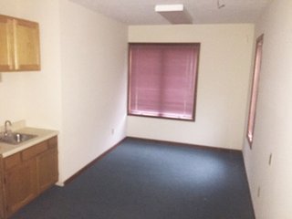 <b>Here is an opportunity to start a new business at a great location without all the costs of owning an individual property.  Excellent for any business that needs a drive-up or a vault, with plenty of parking space.</b><br><br>Built in 1992, this is the end unit of a condo office complex, which used to be a credit union and has a drive-up window.<br><br>Includes two 12x12 offices and a 9x9 vault.  The main floor is 1,510 sq. ft. and the second floor is 286 sq. ft. with an open area that includes a restroom.  Great for an office storage or conference room.  Slab foundation with wood and brick exterior.<br><br>Kendallville City Utilities, with central heat and air conditioning.<br><br>$167.00 takes care of outside maintenance, grass mowing, snow removal, etc. - Condo Office Complex