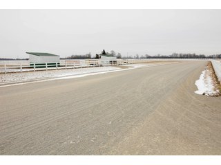 Copperstone Farms is a beautiful facility for horse-lovers, investors, and homeowners.  The grounds are impeccably groomed, the buildings are well-maintained, and the custom designed home is stunning in detail and layout.  The 5090 SF home has 10 rooms including 3 bedrooms, 2 full baths and 2 half baths, a large front porch an enormous great room with hardwood floors, gas fireplace and built-in entertainment center.  The master bedroom suite features a 21x23 bath with his and hers sinks, dressing areas, walk-in closets, large shower and jetted tub.  A private den opens off of the master bedroom and great room with a wall of built-in cabinets for work and storage.  The gourmet kitchen has an abundance of beautiful cabinets, custom features, cook tops, counter tops, breakfast bar and more.  The 4-car garage has custom flooring with ample closet and cabinet storage.  A 12 KW back-up generator provides power in the event of a power outage.

The 158 acres has about 100 acres tillable with about 70 acres that are well-tiled on 50' centers.  Yields a very productive Weighted Average Production Index of 148.  The acreage include about 10 wooded acres and a beautiful 6+/- acre pond to the rear of the home.  

A long private driveway leads to over 18 acres of groomed lawn, woods, pond, barns, and home.  Paver walkways bring you to the expansive front porch that features tiled floors and plenty of room for swings and outdoor furniture.   - SOLD 82.53+/- Acres  (Beautiful Facility for Horse-lovers, Investors and Homeowners)