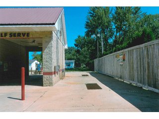 - (2) City Lots
- Built in 1999-2000
- A 26' x 36' concrete block building
- An 18' x 26' concrete block building
- A 16' x 26' concrete block building
- The automatic car wash bay has a 2011 D&S 5000 auto spray unit, with drier.
- There are (2) self-service wash bays.
- (1) Outside self service wash pad
- Coin machine for automatic spray bay, has vac-it-up system
- Coin machine for self service bays
- The wash bays have heat in the floors.
- There is another bay for detailing, storage with (2) 12' x 10'4" overhead doors.  Also this bay has a storage room and there is overhead storage room.
- The operation room contains the soap tanks, pumps, water pressure tank, RO spot free softener, air compressor, furnace and 1/2 bath.
-There are 4 power vac units.
- Also (1) fragrance machine and (1) carpet shampoo machine
- (4) Light poles on the property
<b>UTILITIES</b>
- Private well
- Duke Energy - 3 phase
- Sewer service - Town of Converse - Car Wash on 2 Lots