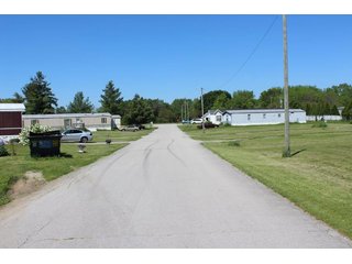 <b>Great Investment Opportunity.  Profitable Family Owned.</b>

40 Pad mobile home park located in the heart of the Orthopedic capital of the world.  

- Private Sewer & Water
- REMC Electric/NIPSCO natural gas/Comcast Cable
- The sewer system has 6 (2000 gal. tanks), with an estimated capacity of 28 GPM.  Each tank also has a leach field.
- Water system:  (2) wells - 4" and 6".
- Pad rent is $240 per month.
- Occupied Lots:  21 lots.
- <b>For financial information, contact the listing Agent.</b>

 - 40 Pad Mobile Home Park