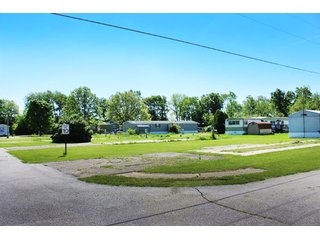 <b>Great Investment Opportunity.  Profitable Family Owned.</b>

40 Pad mobile home park located in the heart of the Orthopedic capital of the world.  

- Private Sewer & Water
- REMC Electric/NIPSCO natural gas/Comcast Cable
- The sewer system has 6 (2000 gal. tanks), with an estimated capacity of 28 GPM.  Each tank also has a leach field.
- Water system:  (2) wells - 4" and 6".
- Pad rent is $240 per month.
- Occupied Lots:  21 lots.
- <b>For financial information, contact the listing Agent.</b>

 - 40 Pad Mobile Home Park