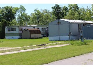 <b>Great Investment Opportunity.  Profitable Family Owned.</b>

40 Pad mobile home park located in the heart of the Orthopedic capital of the world.  

- Private Sewer & Water
- REMC Electric/NIPSCO natural gas/Comcast Cable
- The sewer system has 6 (2000 gal. tanks), with an estimated capacity of 28 GPM.  Each tank also has a leach field.
- Water system:  (2) wells - 4" and 6".
- Pad rent is $240 per month.
- Occupied Lots:  21 lots.
- <b>For financial information, contact the listing Agent.</b>

 - 40 Pad Mobile Home Park