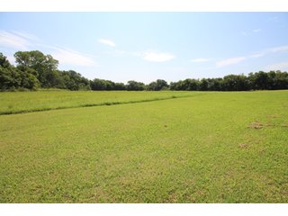 TRACT 1 - SIGNIFICANT LAND & PRODUCING MINERALS AUCTION - 237 +/- SURFACE ACRES IN 4 TRACTS - 18 MINERAL PACKAGES IN GARVIN, MCCLAIN, GRADY & ROGER MILLS COUNTIES, OK - 6 Mo. AVG. CASH FLOW of $196,376/Mo.