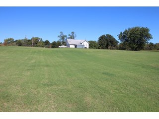 TRACT 1 - SIGNIFICANT LAND & PRODUCING MINERALS AUCTION - 237 +/- SURFACE ACRES IN 4 TRACTS - 18 MINERAL PACKAGES IN GARVIN, MCCLAIN, GRADY & ROGER MILLS COUNTIES, OK - 6 Mo. AVG. CASH FLOW of $196,376/Mo.