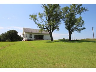 TRACT 1 - SIGNIFICANT LAND & PRODUCING MINERALS AUCTION - 237 +/- SURFACE ACRES IN 4 TRACTS - 18 MINERAL PACKAGES IN GARVIN, MCCLAIN, GRADY & ROGER MILLS COUNTIES, OK - 6 Mo. AVG. CASH FLOW of $196,376/Mo.