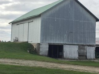 <b>OPEN HOUSE: Thursday December 12, 2 -4 pm</b>
Country living at its best.  This 1,751 sq. ft. home with 3 bedrooms and 2 full baths sits on a beautiful setting of 2.5 acres; open fields and woods are nearby for a view that is indescribable.  The home has a front and side porch with a swing, propane fired hot water heat, separate bedrooms, mud room, vinyl siding, attached 1 car garage and a basement.

<b>1,751 sq, ft. older home on 2.5 Acres
3 bdrm, 2 bath 
Hot Water Heat 
Vinyl Siding
3 Out Buildings.
Attached 1 Car Garage</b> - REAL ESTATE FOR SALE - 1,751 SQ. FT. HOME ON 2.5 ACRES