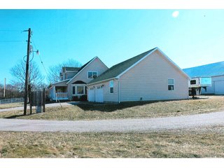 <b>HOUSE, ATTACHED GARAGE & 3+/- ACRES</b>
- <b>Size:</b>  3 Acres
- <b>Frontage:</b>  CR 1000 N         
- <b>Zoning:</b>  100-Ag            
- <b>Year Built:</b>  2012-2013
- <b>Style:</b>  1.5 Story Cape Cod
- <b>Size:</b>  2818 Sq. Ft.
- <b>Basement:</b>  1836 Sq. Ft.
- <b>Bedrooms:</b>  3
- <b>Baths:</b>  3.5       
- <b>Rooms:</b>  5
- <b>Fireplace:</b>  Yes
- <b>Front Porch:</b>  9'x42'
- <b>Back Porch:</b>  11'x42'
- <b>Electric:</b>  200 Amp
- <b>Phase:</b>  1st        
- <b>Air:</b>  Central
- <b>Heat:</b>  LP Gas
- <b>Siding:</b>  Cement Board
- <b>Roof:</b>  Asphalt
<br>       
- <b>Breezeway between house and garage</b>
- <b>Garage:</b>  30' x 36'
- <b>Bath:</b>  Full bath & shower
- <b>Kitchen:</b>  Summer
- <b>Siding:</b>  Cement Board
- <b>Roof:</b>  Asphalt

<b>11.929+/- ACRES, BUILDINGS & PASTURELAND</b>

There is an additional 11.929 acres around the home with tool shed, (2) grain bins, and (2) cattle sheds.  Property has a small creek and pasture land with some fencing.  Frontage on CR 1000 N & 600 W. - Cape Cod Rural Farm Home & Land