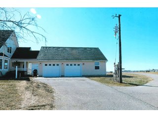 <b>HOUSE, ATTACHED GARAGE & 3+/- ACRES</b>
- <b>Size:</b>  3 Acres
- <b>Frontage:</b>  CR 1000 N         
- <b>Zoning:</b>  100-Ag            
- <b>Year Built:</b>  2012-2013
- <b>Style:</b>  1.5 Story Cape Cod
- <b>Size:</b>  2818 Sq. Ft.
- <b>Basement:</b>  1836 Sq. Ft.
- <b>Bedrooms:</b>  3
- <b>Baths:</b>  3.5       
- <b>Rooms:</b>  5
- <b>Fireplace:</b>  Yes
- <b>Front Porch:</b>  9'x42'
- <b>Back Porch:</b>  11'x42'
- <b>Electric:</b>  200 Amp
- <b>Phase:</b>  1st        
- <b>Air:</b>  Central
- <b>Heat:</b>  LP Gas
- <b>Siding:</b>  Cement Board
- <b>Roof:</b>  Asphalt
<br>       
- <b>Breezeway between house and garage</b>
- <b>Garage:</b>  30' x 36'
- <b>Bath:</b>  Full bath & shower
- <b>Kitchen:</b>  Summer
- <b>Siding:</b>  Cement Board
- <b>Roof:</b>  Asphalt

<b>11.929+/- ACRES, BUILDINGS & PASTURELAND</b>

There is an additional 11.929 acres around the home with tool shed, (2) grain bins, and (2) cattle sheds.  Property has a small creek and pasture land with some fencing.  Frontage on CR 1000 N & 600 W. - Cape Cod Rural Farm Home & Land