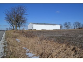 <b>This property offers productive tillable land and a CRP contract on 17.1 acres, with a high rental rate, for conservation and wildlife habitat.</b>  The wooded and grass ridge that crosses part of this property shows signs of heavy deer activity and would also be a beautiful setting for a home or cabin.  This property is in a prime deer location and do not overlook the pond stocked with bass, bluegill and catfish.  There is also a very functional 48ft x 96ft machine shed with a concrete floor and electric.  The sellers will consider divisions of the property.

<i><b>PROPERTY/LISTING DETAILS:</b></I>
<b>Possession Date:</b> At closing subject to farm tenant rights which expire January 1, 2021 
<b>Taxes:</b><i><u> 2019 Real Estate Taxes Payable 2020</u></i> - Property east of Meridian Road (2 tax ID's):  $4,879.74 - Drainage Assessments:  $888.60 - <I><u> 2019 Real Estate Taxes Payable 2020</u></i> - Property west of Meridian Road (1 tax ID):  $4,172.00 - Drainage Assessments:  $859.20
<b>Zoning:</b>  Ag
<b>Other:</b> The sellers will consider divisions of the property.
<i>Note: County tax records show 210.21 acres on the property east of Meridian Road while a 2014 survey shows 211.427 +/- acres.  County tax records show 182.251 acres on the property west of Meridian Road.  Total acres from County Tax records is 392.461.</i>
<b>School District:</b>  North Newton School Corporation    	
<b>Elec. Source:</b>  Newton County REMC
<b><i><u>FSA DATA:</u></b></i>
<b>FSA Cropland:</b>  357.53* acres of which 17.1 acres is in CRP.  <i>*Listing Company estimates approximately 2.5 acres of FSA Cropland not part of property being sold. Contact listing agents for FSA Aerial and other information.</i>
<b>Corn Base Acr.:</b>  182.5,  PLC Yield: 131     
<b>Wheat Base Acr.:</b>  4.2,  PLC Yield:  44    
<b>Soybean Base Acr:</b>  110.0,  PLC Yield:  37	         
<b>Conservation Reserve Program (CRP):</b> 17.1 acres; Annual Rental Rate Per Acre - $339.83;  Contract expires:  September 30, 2025	
<i>Buyer shall assume the existing CRP contract obligations and shall timely sign all documents required by the FSA Office in connection therewith.  Any penalty, repayment and/or interest assessed due to termination, noncompliance and/or owner-ineligibility after closing shall be the responsibility of the Buyer.</i>
<b>Improvements:</b> 48ft X 96ft Pole Building with concrete floor and 220 amp electric service.  23ft 4in wide x 14ft high door, 23ft 4in wide x 12 ft high clearance door & 15ft 3in wide x 12ft high clearance door.
<b>Owners:</b> John and Peggy Luzer - REAL ESTATE FOR SALE - 392.4+/- ACRES - CROPLAND, WOODS FOR HUNTING/RECREATIONAL, POND & POTENTIAL BUILDING SITES