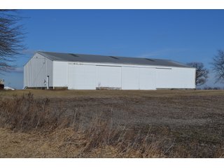 <b>This property offers productive tillable land and a CRP contract on 17.1 acres, with a high rental rate, for conservation and wildlife habitat.</b>  The wooded and grass ridge that crosses part of this property shows signs of heavy deer activity and would also be a beautiful setting for a home or cabin.  This property is in a prime deer location and do not overlook the pond stocked with bass, bluegill and catfish.  There is also a very functional 48ft x 96ft machine shed with a concrete floor and electric.  The sellers will consider divisions of the property.

<i><b>PROPERTY/LISTING DETAILS:</b></I>
<b>Possession Date:</b> At closing subject to farm tenant rights which expire January 1, 2021 
<b>Taxes:</b><i><u> 2019 Real Estate Taxes Payable 2020</u></i> - Property east of Meridian Road (2 tax ID's):  $4,879.74 - Drainage Assessments:  $888.60 - <I><u> 2019 Real Estate Taxes Payable 2020</u></i> - Property west of Meridian Road (1 tax ID):  $4,172.00 - Drainage Assessments:  $859.20
<b>Zoning:</b>  Ag
<b>Other:</b> The sellers will consider divisions of the property.
<i>Note: County tax records show 210.21 acres on the property east of Meridian Road while a 2014 survey shows 211.427 +/- acres.  County tax records show 182.251 acres on the property west of Meridian Road.  Total acres from County Tax records is 392.461.</i>
<b>School District:</b>  North Newton School Corporation    	
<b>Elec. Source:</b>  Newton County REMC
<b><i><u>FSA DATA:</u></b></i>
<b>FSA Cropland:</b>  357.53* acres of which 17.1 acres is in CRP.  <i>*Listing Company estimates approximately 2.5 acres of FSA Cropland not part of property being sold. Contact listing agents for FSA Aerial and other information.</i>
<b>Corn Base Acr.:</b>  182.5,  PLC Yield: 131     
<b>Wheat Base Acr.:</b>  4.2,  PLC Yield:  44    
<b>Soybean Base Acr:</b>  110.0,  PLC Yield:  37	         
<b>Conservation Reserve Program (CRP):</b> 17.1 acres; Annual Rental Rate Per Acre - $339.83;  Contract expires:  September 30, 2025	
<i>Buyer shall assume the existing CRP contract obligations and shall timely sign all documents required by the FSA Office in connection therewith.  Any penalty, repayment and/or interest assessed due to termination, noncompliance and/or owner-ineligibility after closing shall be the responsibility of the Buyer.</i>
<b>Improvements:</b> 48ft X 96ft Pole Building with concrete floor and 220 amp electric service.  23ft 4in wide x 14ft high door, 23ft 4in wide x 12 ft high clearance door & 15ft 3in wide x 12ft high clearance door.
<b>Owners:</b> John and Peggy Luzer - REAL ESTATE FOR SALE - 392.4+/- ACRES - CROPLAND, WOODS FOR HUNTING/RECREATIONAL, POND & POTENTIAL BUILDING SITES