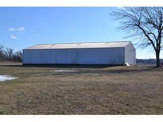 <b>This property offers productive tillable land and a CRP contract on 17.1 acres, with a high rental rate, for conservation and wildlife habitat.</b>  The wooded and grass ridge that crosses part of this property shows signs of heavy deer activity and would also be a beautiful setting for a home or cabin.  This property is in a prime deer location and do not overlook the pond stocked with bass, bluegill and catfish.  There is also a very functional 48ft x 96ft machine shed with a concrete floor and electric.  The sellers will consider divisions of the property.

<i><b>PROPERTY/LISTING DETAILS:</b></I>
<b>Possession Date:</b> At closing subject to farm tenant rights which expire January 1, 2021 
<b>Taxes:</b><i><u> 2019 Real Estate Taxes Payable 2020</u></i> - Property east of Meridian Road (2 tax ID's):  $4,879.74 - Drainage Assessments:  $888.60 - <I><u> 2019 Real Estate Taxes Payable 2020</u></i> - Property west of Meridian Road (1 tax ID):  $4,172.00 - Drainage Assessments:  $859.20
<b>Zoning:</b>  Ag
<b>Other:</b> The sellers will consider divisions of the property.
<i>Note: County tax records show 210.21 acres on the property east of Meridian Road while a 2014 survey shows 211.427 +/- acres.  County tax records show 182.251 acres on the property west of Meridian Road.  Total acres from County Tax records is 392.461.</i>
<b>School District:</b>  North Newton School Corporation    	
<b>Elec. Source:</b>  Newton County REMC
<b><i><u>FSA DATA:</u></b></i>
<b>FSA Cropland:</b>  357.53* acres of which 17.1 acres is in CRP.  <i>*Listing Company estimates approximately 2.5 acres of FSA Cropland not part of property being sold. Contact listing agents for FSA Aerial and other information.</i>
<b>Corn Base Acr.:</b>  182.5,  PLC Yield: 131     
<b>Wheat Base Acr.:</b>  4.2,  PLC Yield:  44    
<b>Soybean Base Acr:</b>  110.0,  PLC Yield:  37	         
<b>Conservation Reserve Program (CRP):</b> 17.1 acres; Annual Rental Rate Per Acre - $339.83;  Contract expires:  September 30, 2025	
<i>Buyer shall assume the existing CRP contract obligations and shall timely sign all documents required by the FSA Office in connection therewith.  Any penalty, repayment and/or interest assessed due to termination, noncompliance and/or owner-ineligibility after closing shall be the responsibility of the Buyer.</i>
<b>Improvements:</b> 48ft X 96ft Pole Building with concrete floor and 220 amp electric service.  23ft 4in wide x 14ft high door, 23ft 4in wide x 12 ft high clearance door & 15ft 3in wide x 12ft high clearance door.
<b>Owners:</b> John and Peggy Luzer - REAL ESTATE FOR SALE - 392.4+/- ACRES - CROPLAND, WOODS FOR HUNTING/RECREATIONAL, POND & POTENTIAL BUILDING SITES