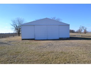 <b>This property offers productive tillable land and a CRP contract on 17.1 acres, with a high rental rate, for conservation and wildlife habitat.</b>  The wooded and grass ridge that crosses part of this property shows signs of heavy deer activity and would also be a beautiful setting for a home or cabin.  This property is in a prime deer location and do not overlook the pond stocked with bass, bluegill and catfish.  There is also a very functional 48ft x 96ft machine shed with a concrete floor and electric.  The sellers will consider divisions of the property.

<i><b>PROPERTY/LISTING DETAILS:</b></I>
<b>Possession Date:</b> At closing subject to farm tenant rights which expire January 1, 2021 
<b>Taxes:</b><i><u> 2019 Real Estate Taxes Payable 2020</u></i> - Property east of Meridian Road (2 tax ID's):  $4,879.74 - Drainage Assessments:  $888.60 - <I><u> 2019 Real Estate Taxes Payable 2020</u></i> - Property west of Meridian Road (1 tax ID):  $4,172.00 - Drainage Assessments:  $859.20
<b>Zoning:</b>  Ag
<b>Other:</b> The sellers will consider divisions of the property.
<i>Note: County tax records show 210.21 acres on the property east of Meridian Road while a 2014 survey shows 211.427 +/- acres.  County tax records show 182.251 acres on the property west of Meridian Road.  Total acres from County Tax records is 392.461.</i>
<b>School District:</b>  North Newton School Corporation    	
<b>Elec. Source:</b>  Newton County REMC
<b><i><u>FSA DATA:</u></b></i>
<b>FSA Cropland:</b>  357.53* acres of which 17.1 acres is in CRP.  <i>*Listing Company estimates approximately 2.5 acres of FSA Cropland not part of property being sold. Contact listing agents for FSA Aerial and other information.</i>
<b>Corn Base Acr.:</b>  182.5,  PLC Yield: 131     
<b>Wheat Base Acr.:</b>  4.2,  PLC Yield:  44    
<b>Soybean Base Acr:</b>  110.0,  PLC Yield:  37	         
<b>Conservation Reserve Program (CRP):</b> 17.1 acres; Annual Rental Rate Per Acre - $339.83;  Contract expires:  September 30, 2025	
<i>Buyer shall assume the existing CRP contract obligations and shall timely sign all documents required by the FSA Office in connection therewith.  Any penalty, repayment and/or interest assessed due to termination, noncompliance and/or owner-ineligibility after closing shall be the responsibility of the Buyer.</i>
<b>Improvements:</b> 48ft X 96ft Pole Building with concrete floor and 220 amp electric service.  23ft 4in wide x 14ft high door, 23ft 4in wide x 12 ft high clearance door & 15ft 3in wide x 12ft high clearance door.
<b>Owners:</b> John and Peggy Luzer - REAL ESTATE FOR SALE - 392.4+/- ACRES - CROPLAND, WOODS FOR HUNTING/RECREATIONAL, POND & POTENTIAL BUILDING SITES