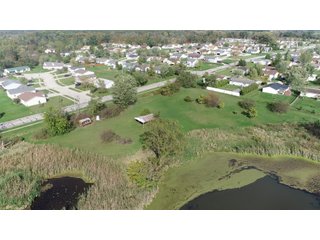 3 bedroom home is surrounded by mature trees and overlooking a 4+-acre pond. Endless possibilities to make this paradise your own. Historic Mail Pouch advertising on the barn adds to the individuality of this property! - REAL ESTATE FOR SALE - 7.9+/- ACRES NESTLED WITHIN THE CITY LIMITS OF COLUMBIA CITY, INDIANA