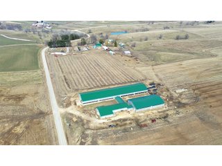 This 108+/- acre READY-TO-GO DAIRY FARM sits just 5.2 miles south of Lancaster, WI containing highly productive soils (Downs and Fayette). The farms modern, fully operational dairy has 200 sand bedded free stalls, 40 stall transition barn and 20 head bedding pack fresh pens. This is a fully functional dairy just waiting to go!<br>
The parlor is a VERY CLEAN Double 8 (expandable to 10) and includes GEA cow information along with TAS management program. There is a 2,500 gallon Mueller bulk tank. The office is fully equipped including bathroom and shower. Heat and electricity continue to be maintained.<br>
Additional buildings include loose housing cattle shed (40 head), Quonset machine shed and hay barn. The farm is equipped with a standby generator and two wells. There are two large earthen bunkers with cement floors and 7,000 bushel grain bin. The older farm house has a new septic system. Manure easement is available on bordering property with more land available to rent for adequate feed supply. - REAL ESTATE FOR SALE - 108+/- ACRES