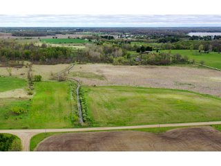 This property consists of approximately 40+/- acres and several beautiful potential building sites. The combination of woods, water, and grassland provide for a unique habitat attractive to many game species. This quiet area is prime hunting land for deer, turkey, and pheasant. Do not miss out on this unique recreational and development opportunity!  - Real Estate Listing - Property for Sale - 40+/- Acres