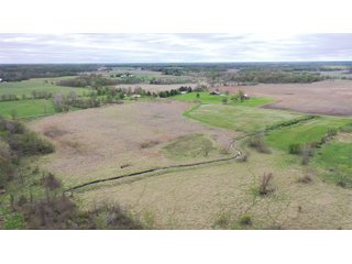 This property consists of approximately 40+/- acres and several beautiful potential building sites. The combination of woods, water, and grassland provide for a unique habitat attractive to many game species. This quiet area is prime hunting land for deer, turkey, and pheasant. Do not miss out on this unique recreational and development opportunity!  - Real Estate Listing - Property for Sale - 40+/- Acres