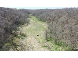 This 32+/- acre piece of timber sits in the middle of an area known for quality whitetail deer hunting. With both south and north facing hillsides spanning the property and a flat, open creek bottom, there are numerous locations for box blinds with great visibility. There are well defined deer trails throughout the property along with UTV access. The 4.97+/- acres of CRP that lays in the bottom of the valley provide income while at the same time creating wildlife habitat. This is also the perfect spot for future food plots. An easement through the farm off of Kittoe Lane gains access to this newly sectioned parcel. - REAL ESTATE FOR SALE - 32+/- ACRES - GRANT COUNTY, WI