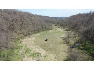 This 32+/- acre piece of timber sits in the middle of an area known for quality whitetail deer hunting. With both south and north facing hillsides spanning the property and a flat, open creek bottom, there are numerous locations for box blinds with great visibility. There are well defined deer trails throughout the property along with UTV access. The 4.97+/- acres of CRP that lays in the bottom of the valley provide income while at the same time creating wildlife habitat. This is also the perfect spot for future food plots. An easement through the farm off of Kittoe Lane gains access to this newly sectioned parcel. - REAL ESTATE FOR SALE - 32+/- ACRES - GRANT COUNTY, WI